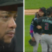 Arizona Diamondbacks player Ketel Marte consoled by teammates on the field after fan mocks his deceased mother