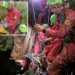 Rescuers work to free an injured cave explorer trapped more than 130 feet underground in Italy