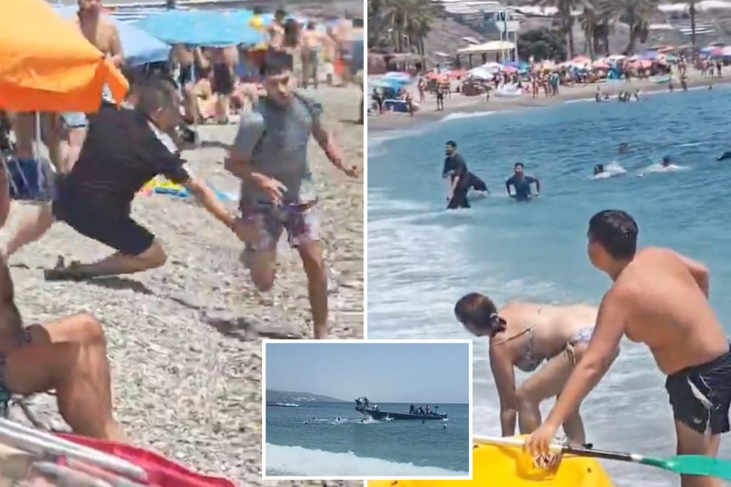 Wild video shows sunbathers tackling migrants who jump off boat at a packed beach in Spain