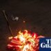 Trump signs order to criminally charge those who burn US flag in protest