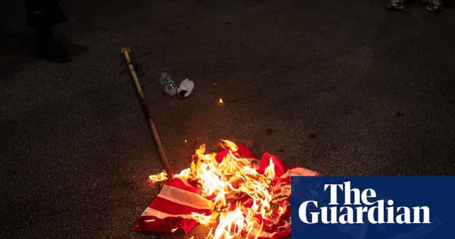 Trump signs order to criminally charge those who burn US flag in protest