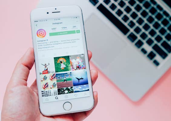 
BANGKOK,THAILAND - June 28,2016: Hand holding Apple iPhone6s with Instagram application on the screen with laptop background. Instagram is a photo-sharing app for smartphones.