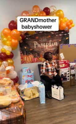 Video of a pumpkin-themed "GRANDmother baby shower" with a woman, presumably the grandma to be, surrounded by presents.