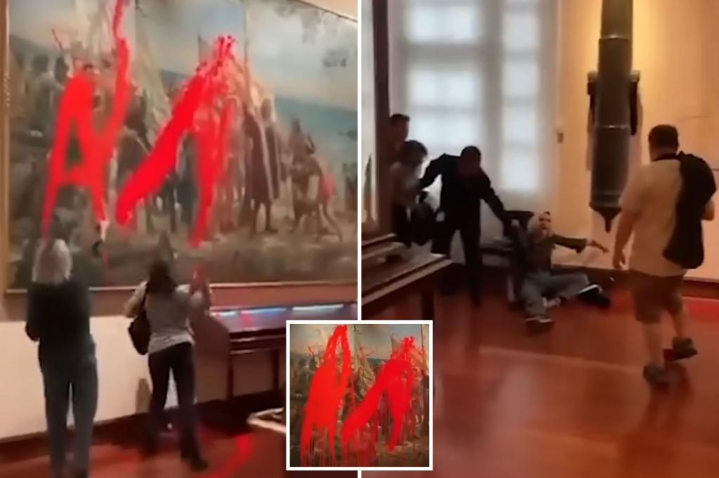 Climate activists hurl red paint at Christopher Columbus mural in caught-on-video vandalism
