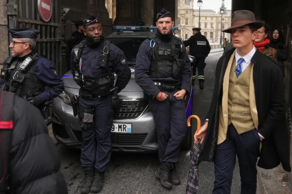 Dapper man sparks intrigue after appearing at Louvre jewel heist investigation