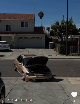 @4o8.ak/TikTok parked Honda sedan with hood up