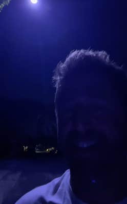 @evanlovett/TikTok under bluish purple streetlight at night