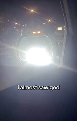 @alexamcnee/TikTok glare in side view mirror from bright headlights in traffic and onscreen text: i almost saw god