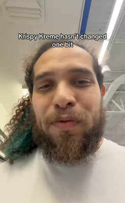 Man with long curly hair and beard talking to his phone. Text overlay reads, "Krispy Kreme hasn't changed one bit."