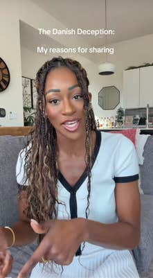 A Black woman sitting down in a sunny room to talk to her camera, gesturing with her hands as she speaks. Text overlay reads, "My reasons for sharing."