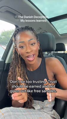 Onyeka sitting in her car talking about the lessons she learned from her experience.