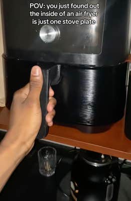 @welcometheekidd/TikTok looking inside an air fryer appliance with onscreen text: “POV: you just found out the inside of an air fryer is just one stove plate,” as dramatic music played.