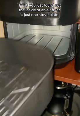 @welcometheekidd/TikTok looking inside an air fryer appliance with onscreen text: “POV: you just found out the inside of an air fryer is just one stove plate,” as dramatic music played.