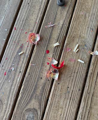 u/ashleygee via Reddit broken christmas bauble with rolled up notes inside