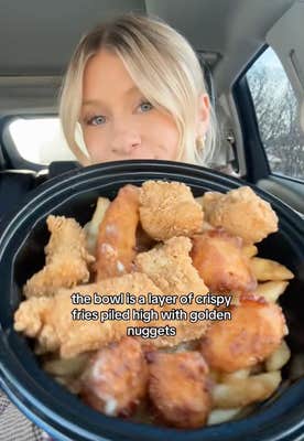 @eatsbynat/TikTok "the bowl is a layer of crispy fired piled high with golden nuggets" KFC's poutine bowl