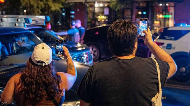 The Trump administration says it's illegal to record videos of ICE. Here's what the law says.