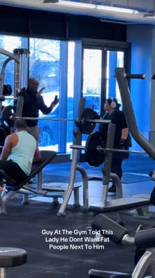Confrontation at the gym, both people are holding their phones up, recording each other as they shout.